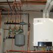 Thermal Climate Control installation of a Gas Fired Hot Water Boiler system in M